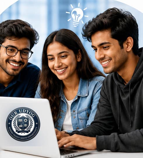 Three Our Udyog interns collaborating on a laptop